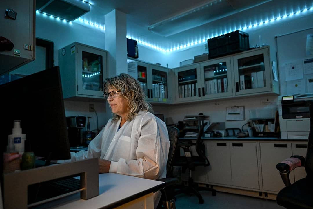 A lab tech worker at her computer at Lincoln Health Community Hospital in Hugo, Colorado.